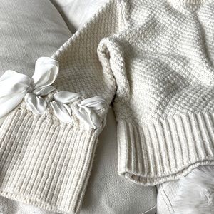Beautiful Club Monaco knit sweater with ribbon detail.